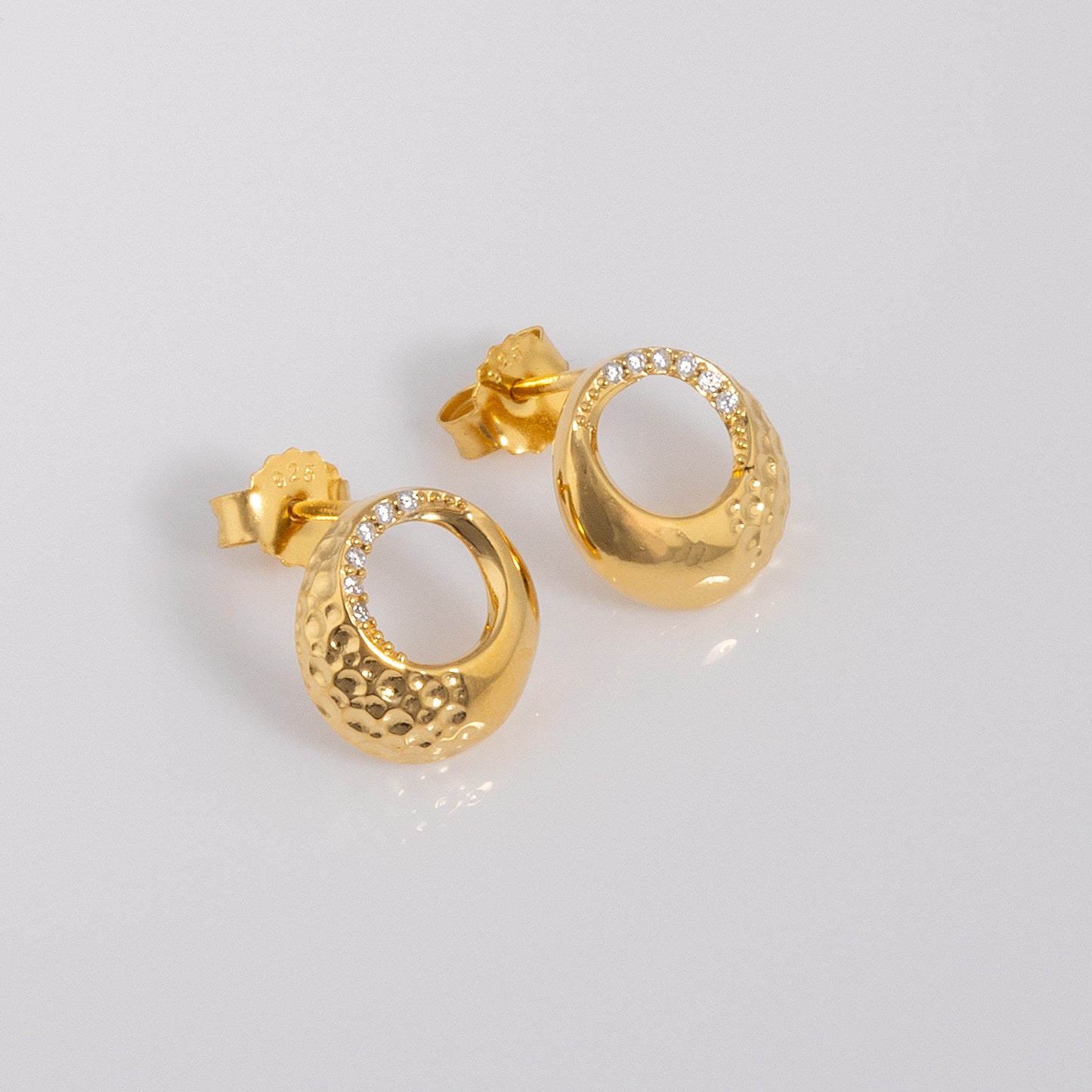 Gold Vermeil Circle Stud Earrings with White Cubic Zirconia. The earrings have a butterfly clasp. Hypoallergenic and nickle free