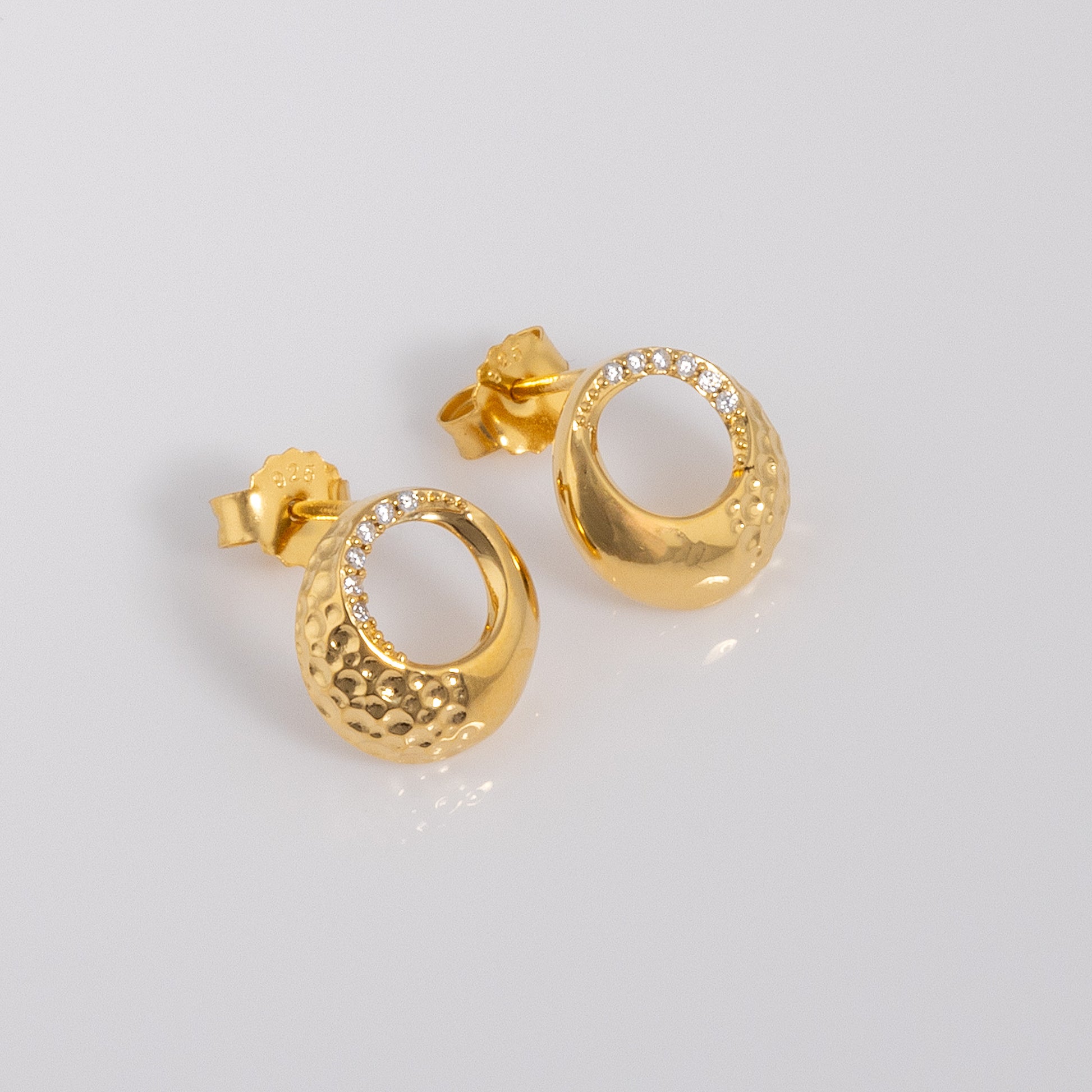 Gold Vermeil Circle Stud Earrings with White Cubic Zirconia. The earrings have a butterfly clasp. Hypoallergenic and nickle free