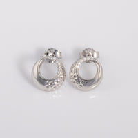 Rhodium plated silver Circle Stud Earrings with White Cubic Zirconia and a textured finish. An elegant, dressy pair of earrings with a butterfly back. Suitable for sensitive ears, nickle free