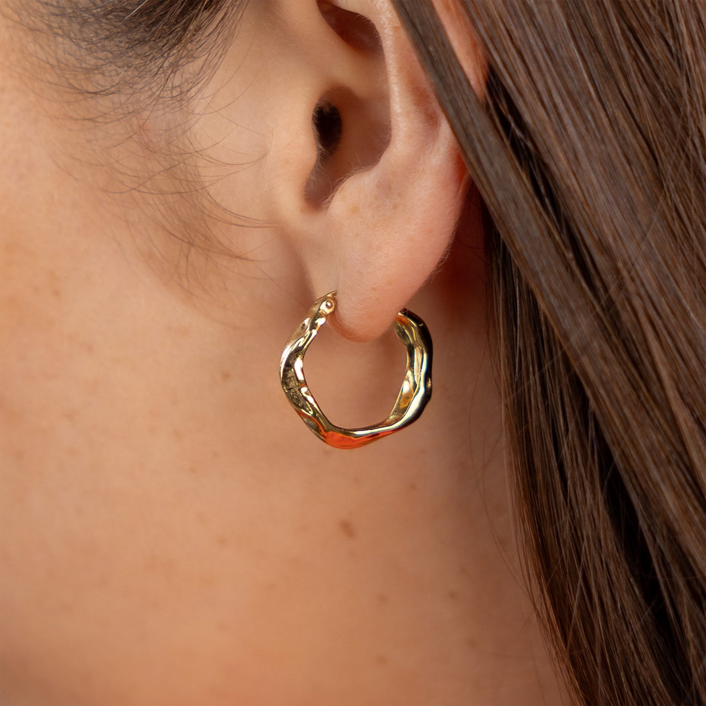 Stunning gold vermeil hoop earrings. These hoop earrings have a leverback and are a textured molten finish.