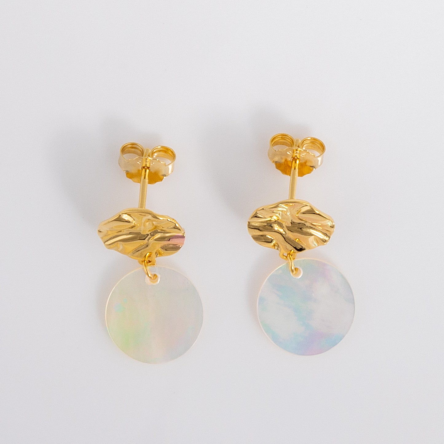 Textured, molten design, Gold Vermeil Stud Earrings with a dangling disc made from Mother of Pearl. The earings have a butterfly back and are nickle free for all skin types.