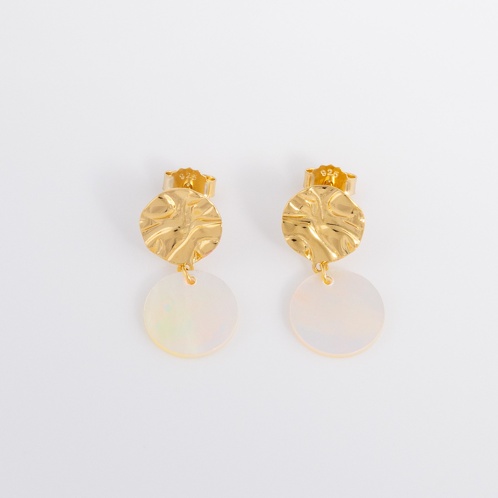 Stunning molten Textured Gold Vermeil Stud Earrings with Mother of Pearl Dangling. The earrings have a butterfly back and are hypoallergenic and tarnish resistant.