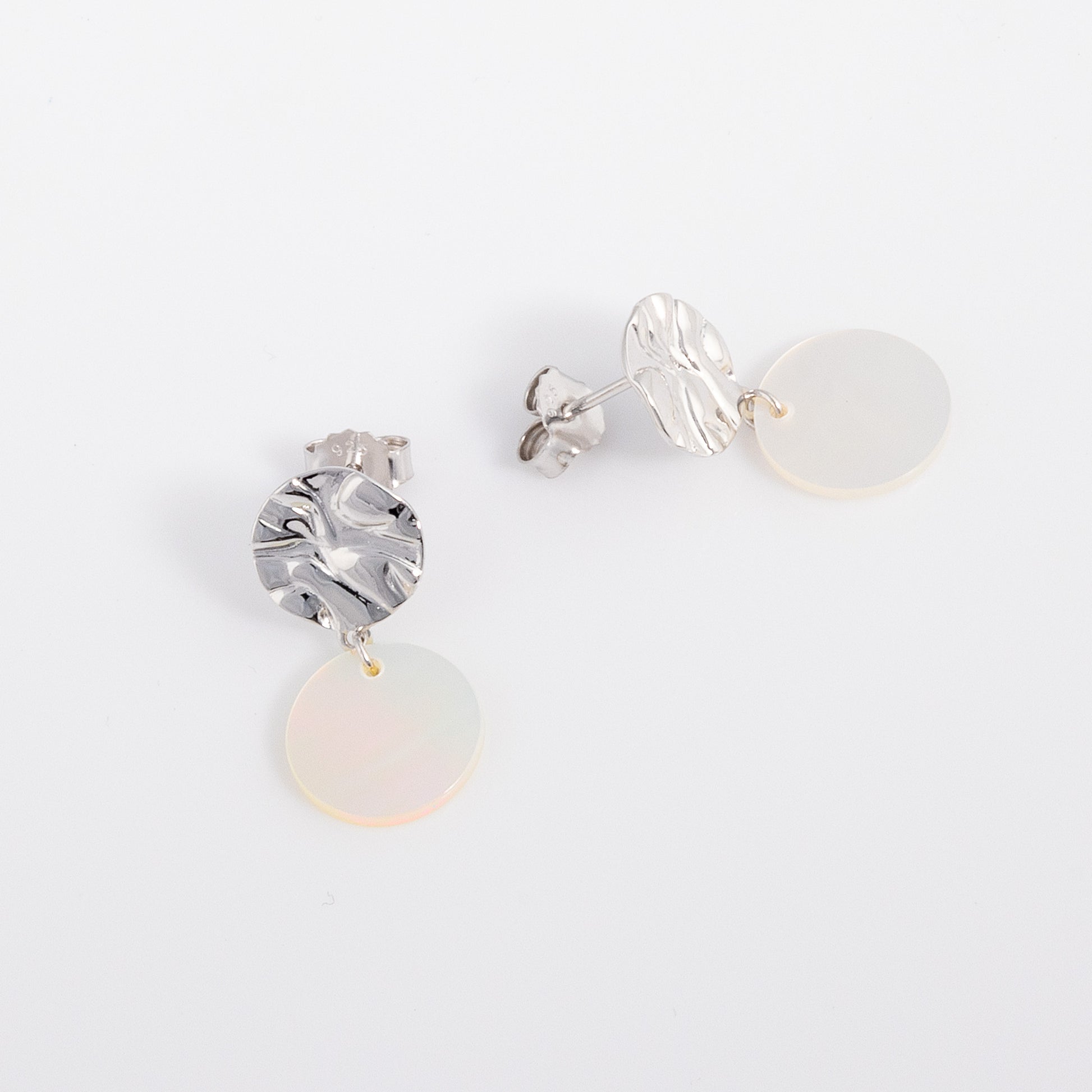 Textured Silver Rhodium Stud Earrings with Mother of Pearl Dangling. Comfortable and lightweight, nickle free earrings for all skin types. Butterfly back studs