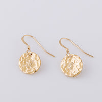 14ct gold-fill fish hook earrings. Two 14ct gold-fill disc earrings hand stamped with a rose, Junes birth flower. The discs have a hammered finish, which creates a gorgeous sparkle in the light.
