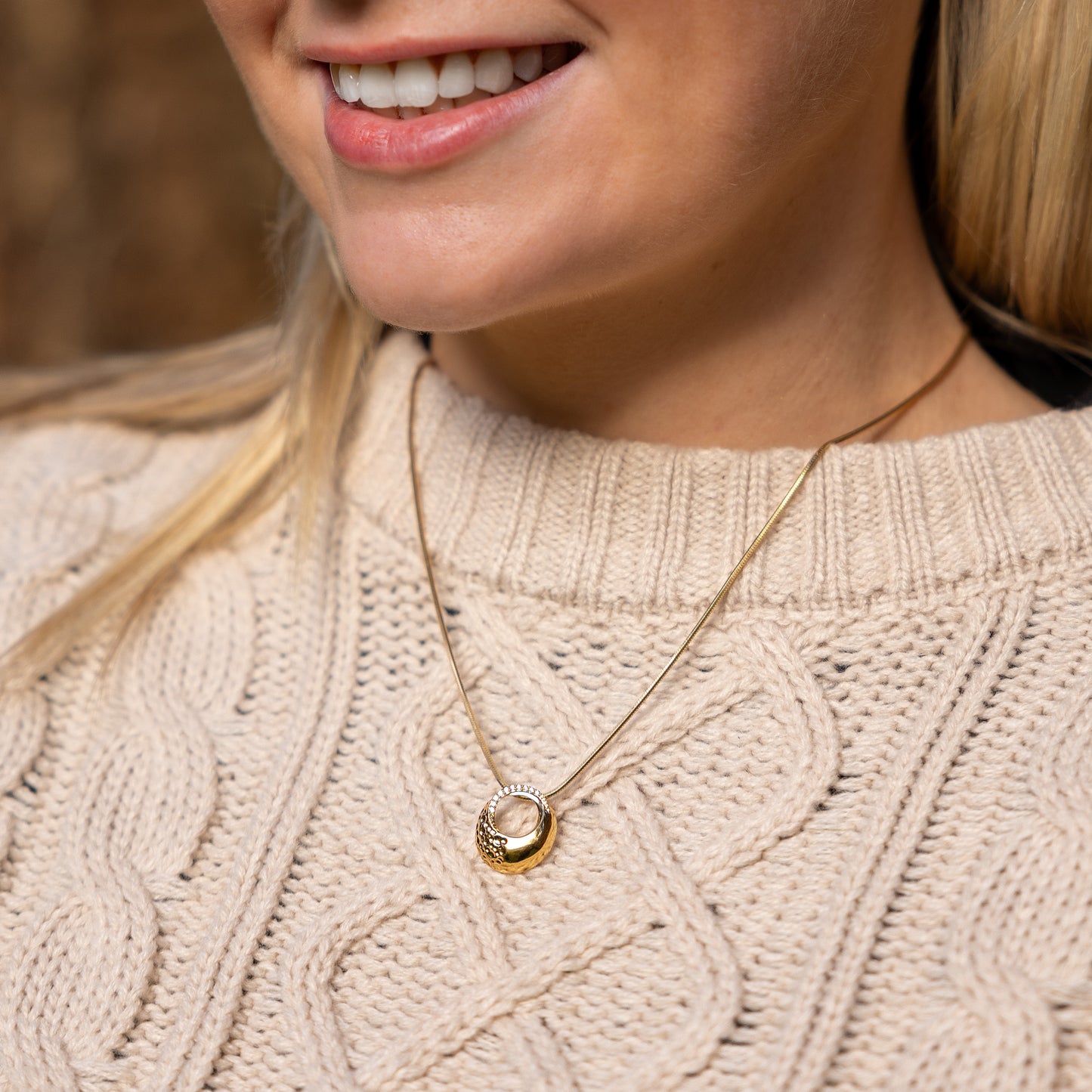 Model wearing an elegant Gold Vermeil Circle Pendant Necklace with White Cubic Zirconia. The necklace has a snake chain with a lobster clasp, tarnish free and hypoallergenic.