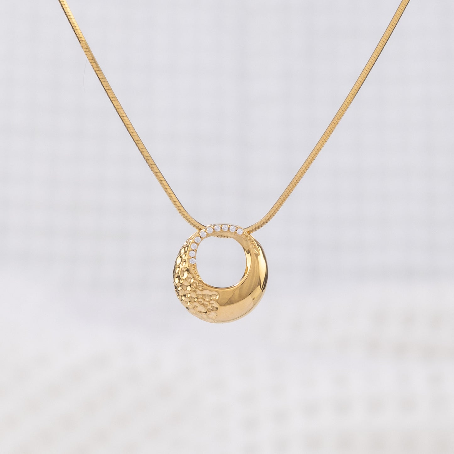 Classic gold Vermeil Circle Pendant Necklace with White Cubic Zirconia. The pendant hangs on a snake chain, giving a chic, elegant look. Tranish free and nickle free!