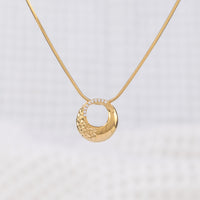 Classic gold Vermeil Circle Pendant Necklace with White Cubic Zirconia. The pendant hangs on a snake chain, giving a chic, elegant look. Tranish free and nickle free!