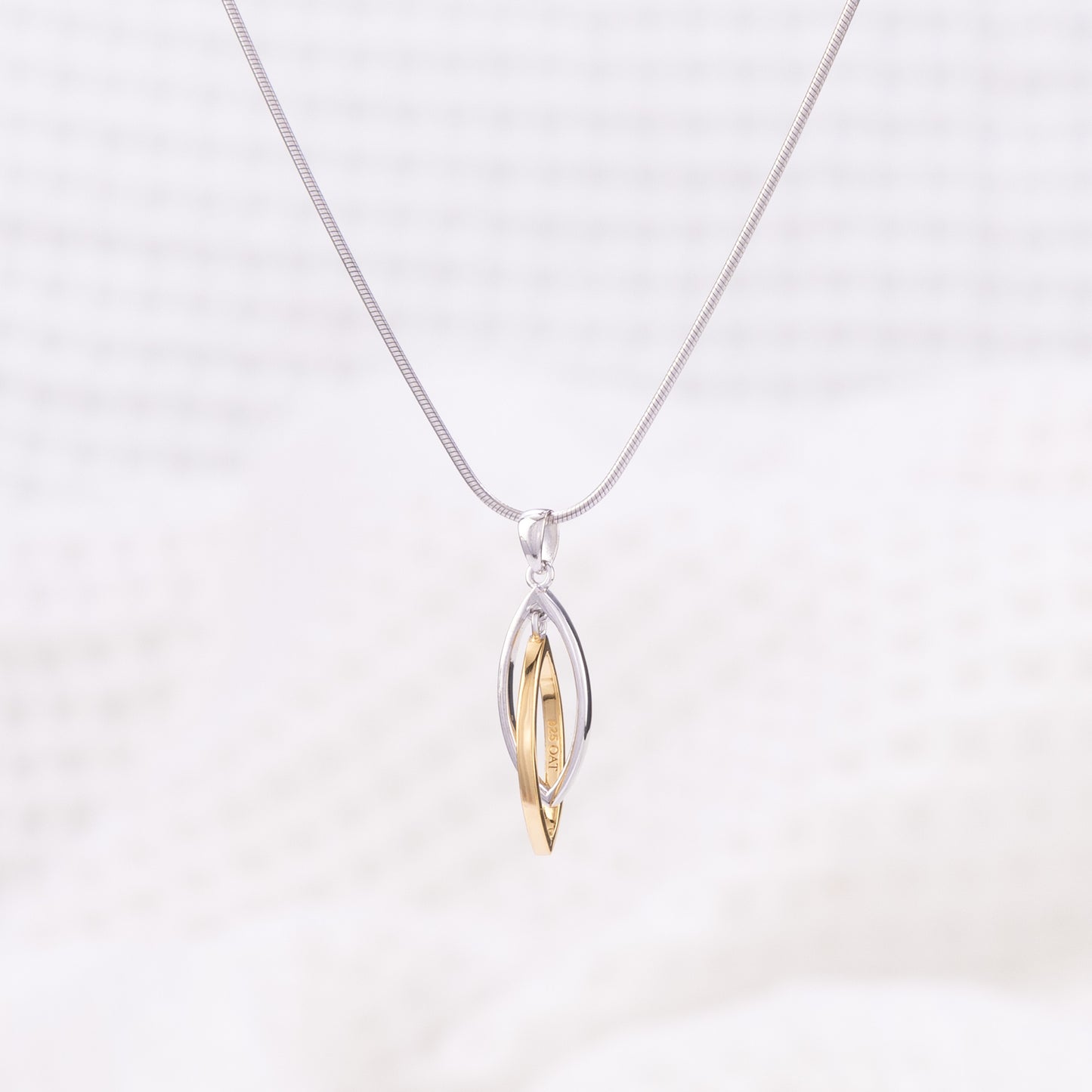 Silver Rhodium and Gold Vermeil Pendant Necklace with Two Intertwining Shapes