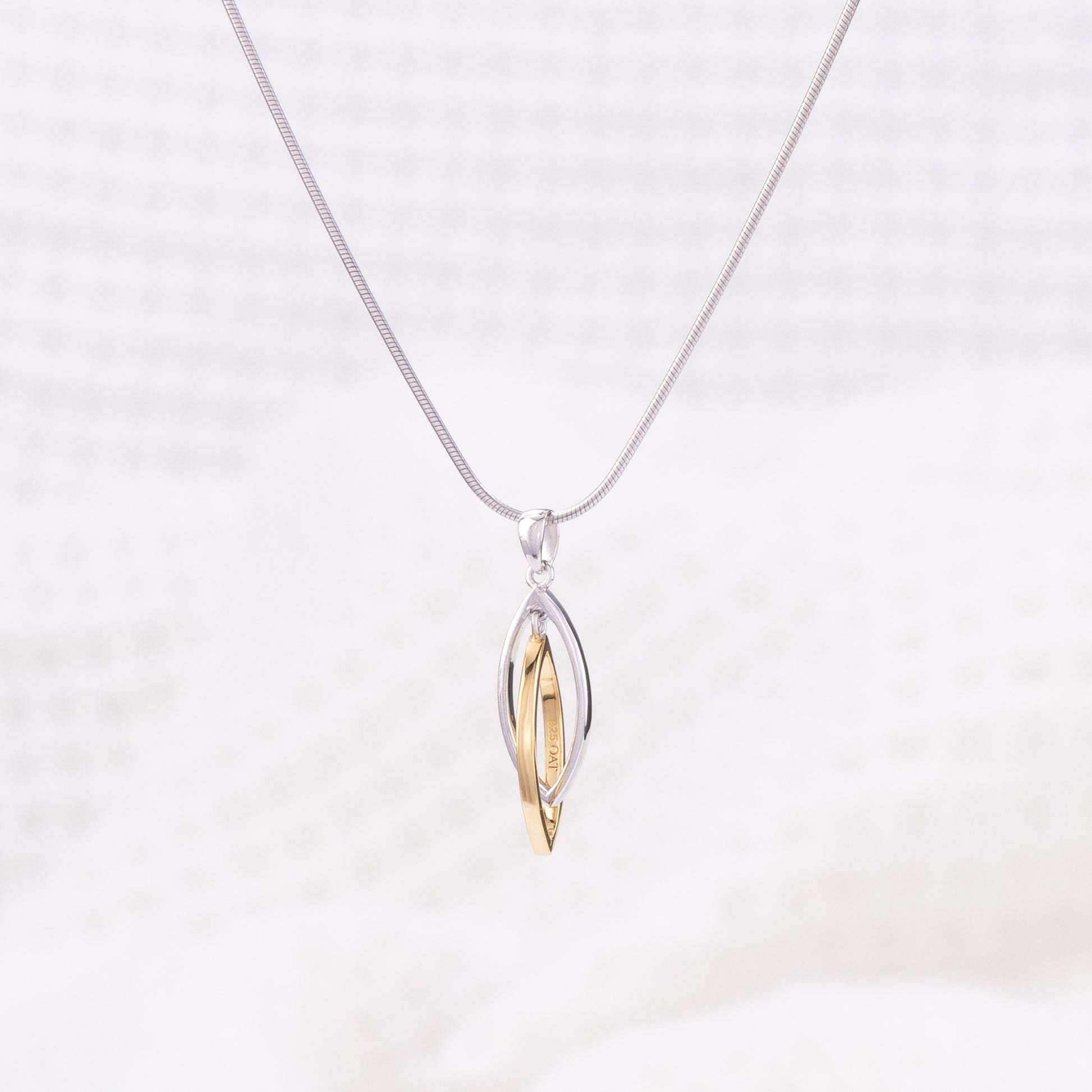 Silver Rhodium and Gold Vermeil Pendant Necklace with Two Intertwining Shapes