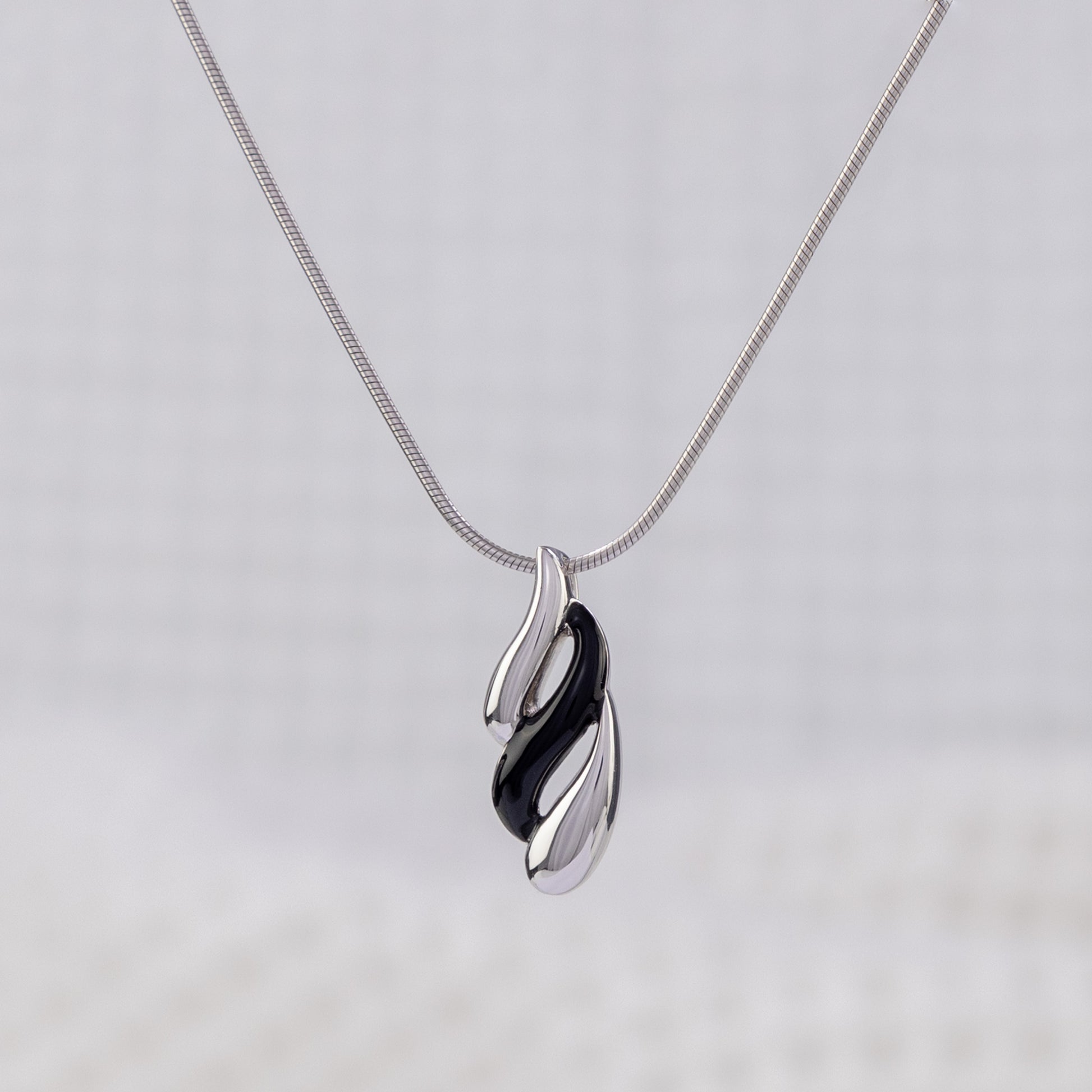 Silver Rhodium and Black Enamel Pendant Necklace with Wave Design