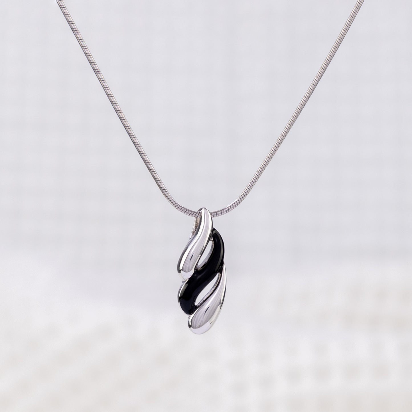 Silver Rhodium and Black Enamel Pendant Necklace with Wave Design