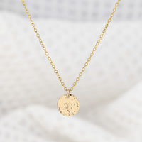 14ct gold filled pendant necklace, personalised with astrology sign. The disc pendant is a hammered texture and hand is stamped with a star sign. The chain is delicate and adjustable in lenght. Trnish resistant and hypoallergenic.