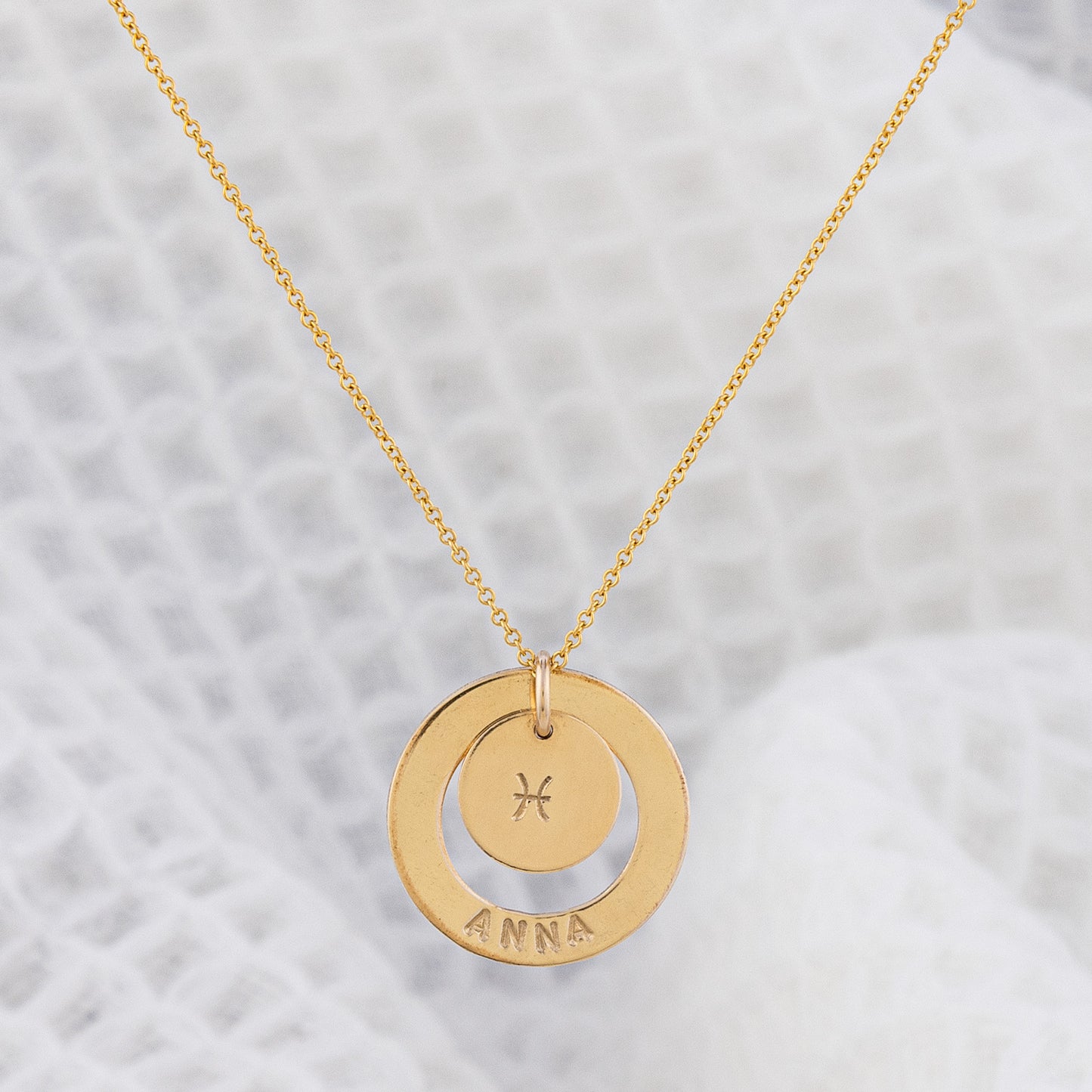 Fan favourite Dooey necklace from OAT Jewellery. 14ct gold-filled necklace, tarnosh free and hypoallergenic, suitable for everyday wear! personalised with your name on the halo pendant and your star sign on the centre disc pendant. A gorgeous piece handmade in Ireland
