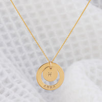 Fan favourite Dooey necklace from OAT Jewellery. 14ct gold-filled necklace, tarnosh free and hypoallergenic, suitable for everyday wear! personalised with your name on the halo pendant and your star sign on the centre disc pendant. A gorgeous piece handmade in Ireland