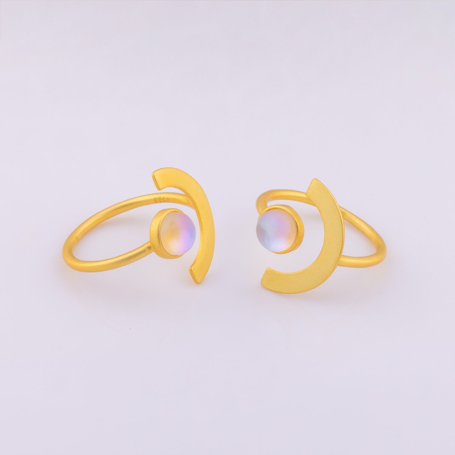 Funky eclipse style ring with a colour shifting stone. The gold vermeil ring is an adjustable size and hypoallergenic