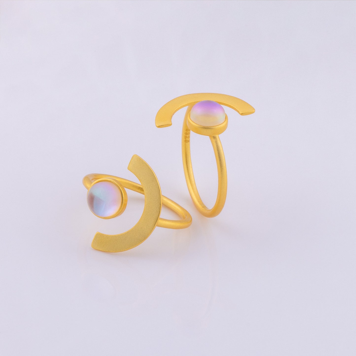 Unique eclipse design ring with a colour shifting stone. A satin finish gold vermeil ring that is adjustable to fit any ring size!