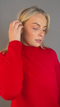 Video of model wearing Rhodium plated silver Circle Stud Earrings with White Cubic Zirconia. The textured finish of the earring catches the light and shines. Hypoallergenic and suitable for sensitive skin