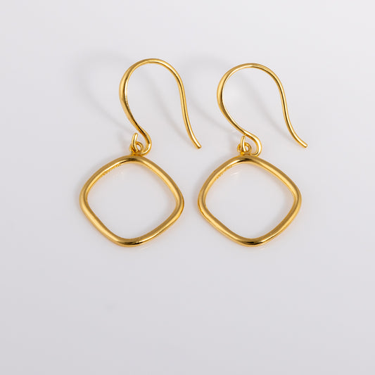 Simple and dainty Gold Vermeil Hook Earrings. They feature a hanging geometric ring. 