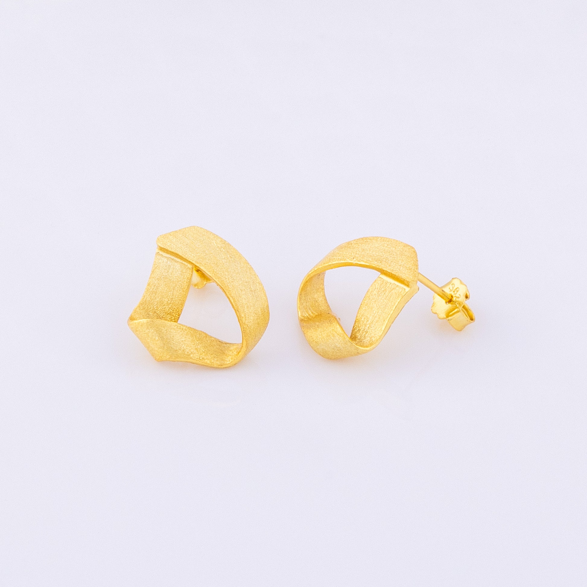 OAT Jewellery gold vermeil knot design, matte earrings. Two satin finish stud earrings that are lightweight, hypoallergenic and tarnish resistant. High quality everyday earrings!