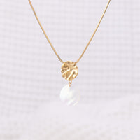 Molten design, Textured Gold Vermeil Pendant Necklace with Mother of Pearl Dangling. The pendant hangs on a snake chain