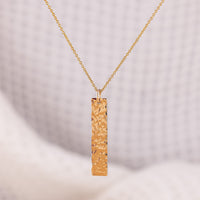 Sparkly, textured, 14ct gold-fill bar pendant necklace. The pendant can be be customised with a word of your choice. It hangs on a small jump ring, on a fine gold chain