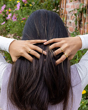 Anya showing a selection of our gold vermeil rings.