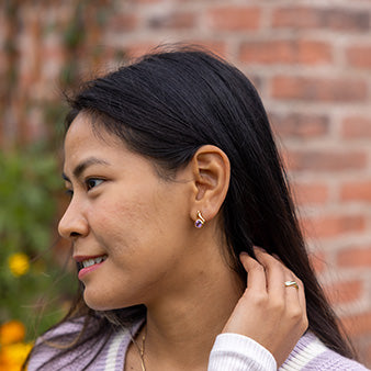 Anya modelling our Amazonia gold vermeil earrings.