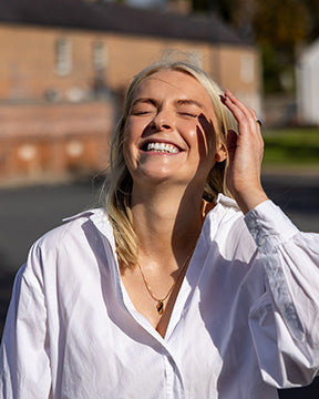 Roisín wearing our gold vermeil Rainer pendant necklace.